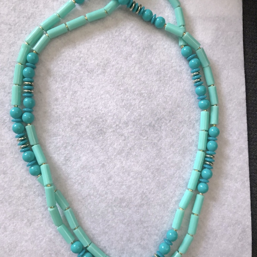 Vintage aqua color acrylic beads with silver accents.